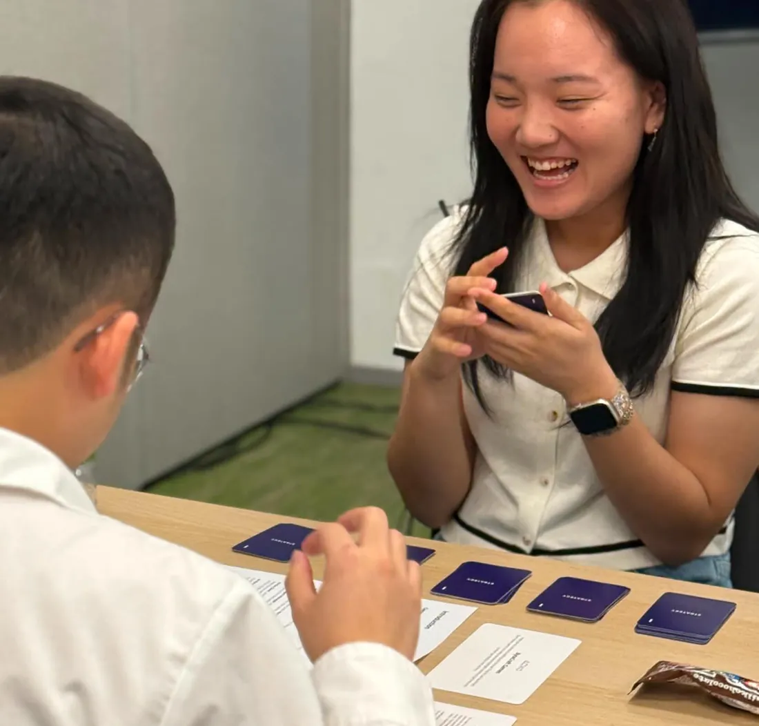 A player laughing mid-round at a Client Quest table